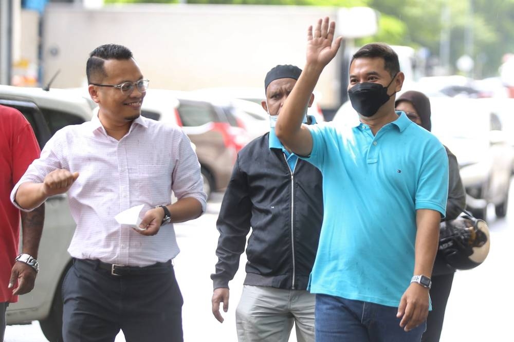 PKR deputy president Rafizi Ramli (right) and Setiawangsa MP Nik Nazmi Nik Ahmad are pictured at the Setiawangsa police station July 19, 2022. — Picture by Ahmad Zamzahuri