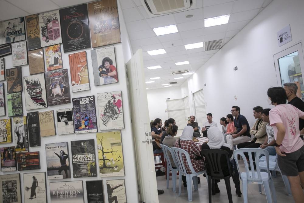 The play's cast and crew taking a break from day long rehearsals at the Five Arts Centre in GMBB, Kuala Lumpur. 