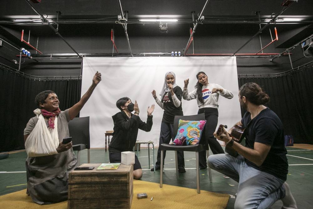 ICT artistic director and dramaturg for the play Jo Kukathas stands in for an actor during rehearsals for 'And Then Came Spring', at the Five Arts Centre in GMBB, Kuala Lumpur.