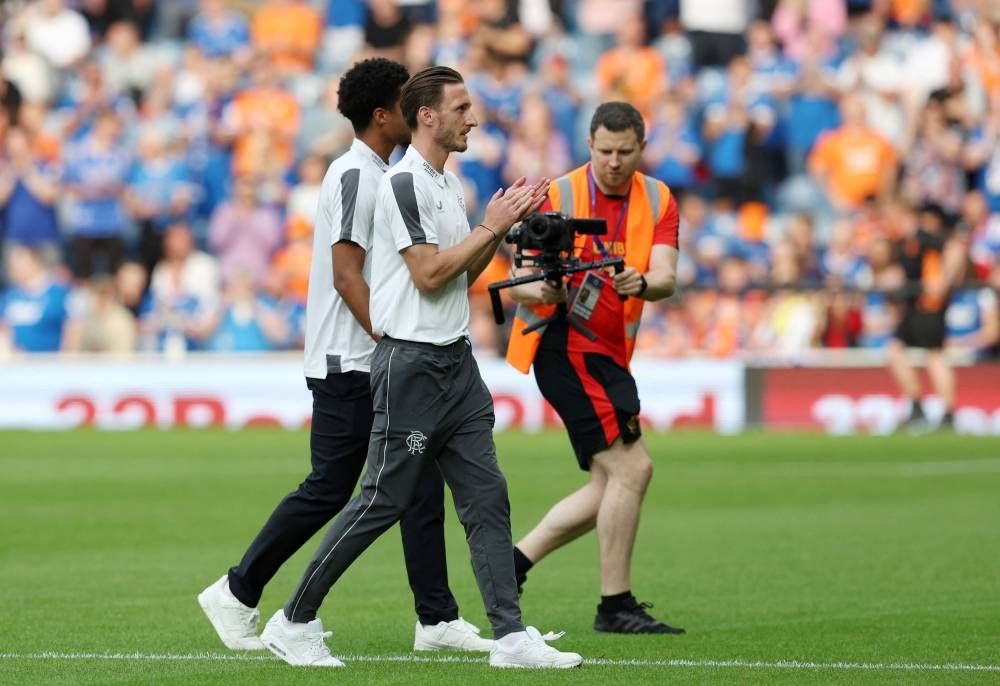 Rangers present new signing Ben Davies to the crowd before the match against West Ham United at the Ibrox Stadium, Glasgow July 19, 2022. — Reuters pic 