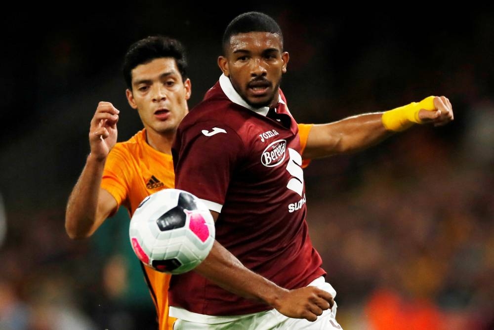 Torino's Gleison Bremer in action with Wolverhampton Wanderers' Raul Jimenez at the Molineux Stadium, Wolverhampton August 29, 2019. — Reuters pic 