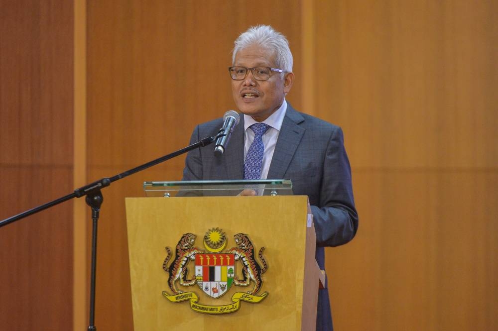 Home Minister Datuk Seri Hamzah Zainuddin  delivers his speech in Putrajaya July 13, 2022. — Picture by Shafwan Zaidon
