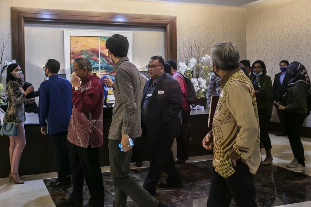 Cabinet members and MPs arrive at the Seri Pacific Hotel KL for the closed-door Sulu claim briefing July 21, 2022. — Picture by Hari Anggara