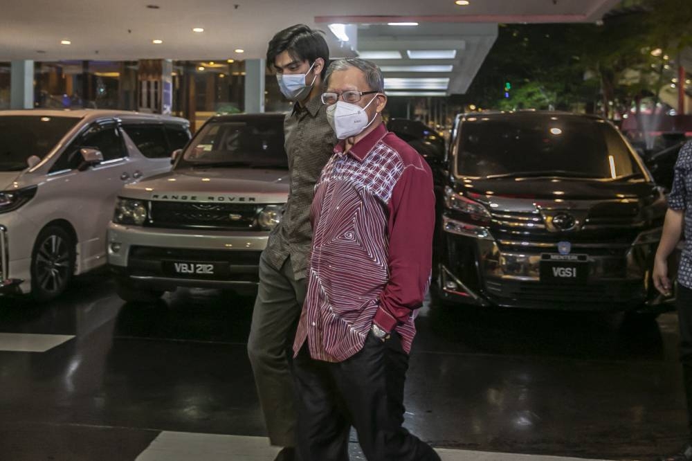 Economic affairs minister Datuk Seri Mustapa Mohamed arrives at the Seri Pacific Hotel KL for the closed-door Sulu claim briefing July 21, 2022. — Picture by Hari Anggara