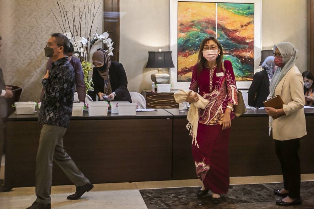 Cabinet members and MPs arrive at the Seri Pacific Hotel KL for the closed-door Sulu claim briefing July 21, 2022. — Picture by Hari Anggara