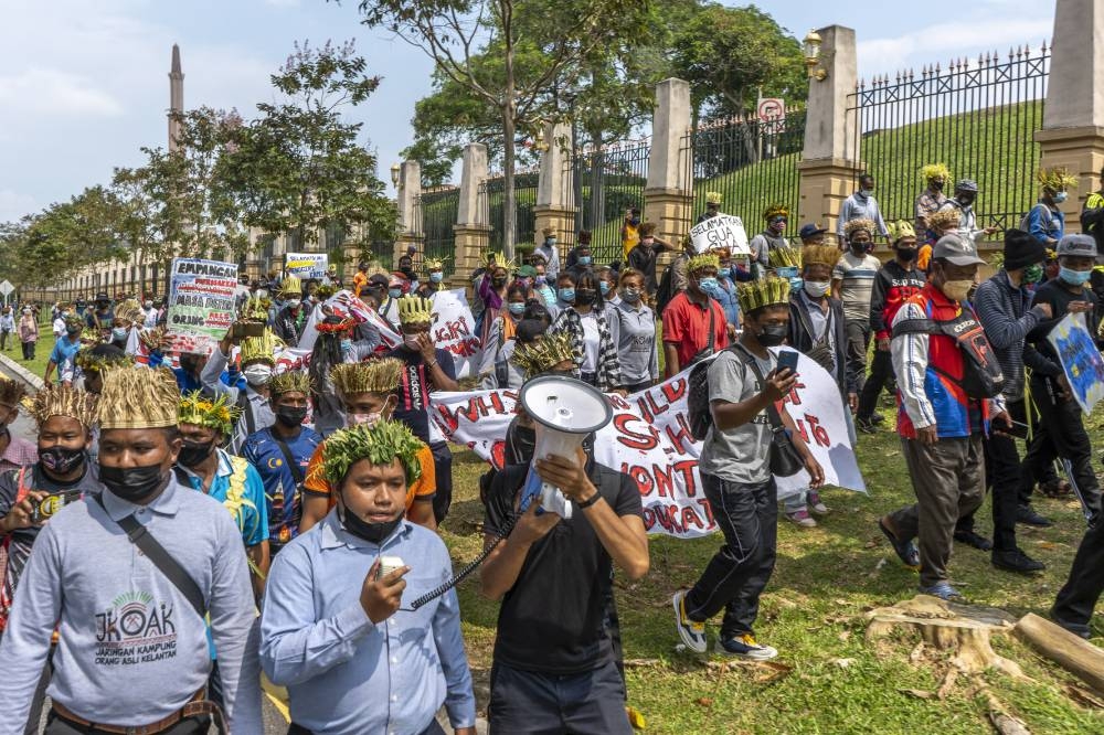 Orang Asli Temiar from Kelantan gather at Dataran Putra and march to the prime minister's office to hand over the memorandum to protest the construction of the Nenggiri Dam in Gua Musang June 7, 2022. — Picture by Shafwan Zaidon