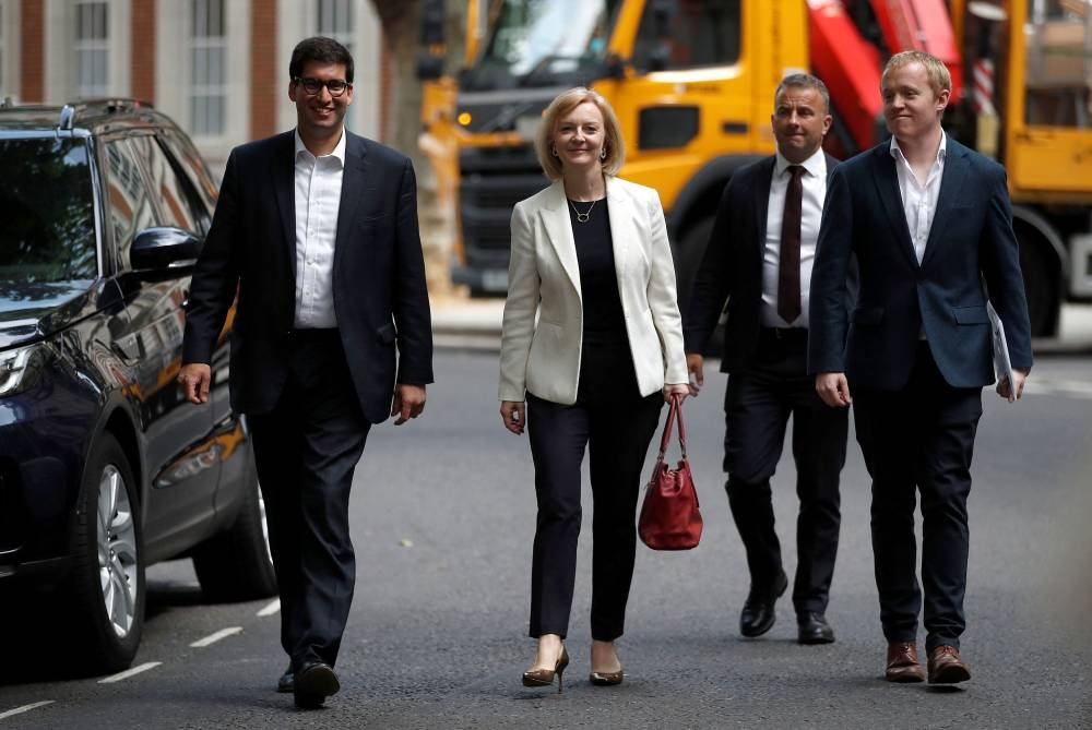 British Foreign Secretary Liz Truss (second, right) arrives at a hustings event, part of the Conservative party leadership campaign, in London, Britain July 21, 2022. ― Reuters pic