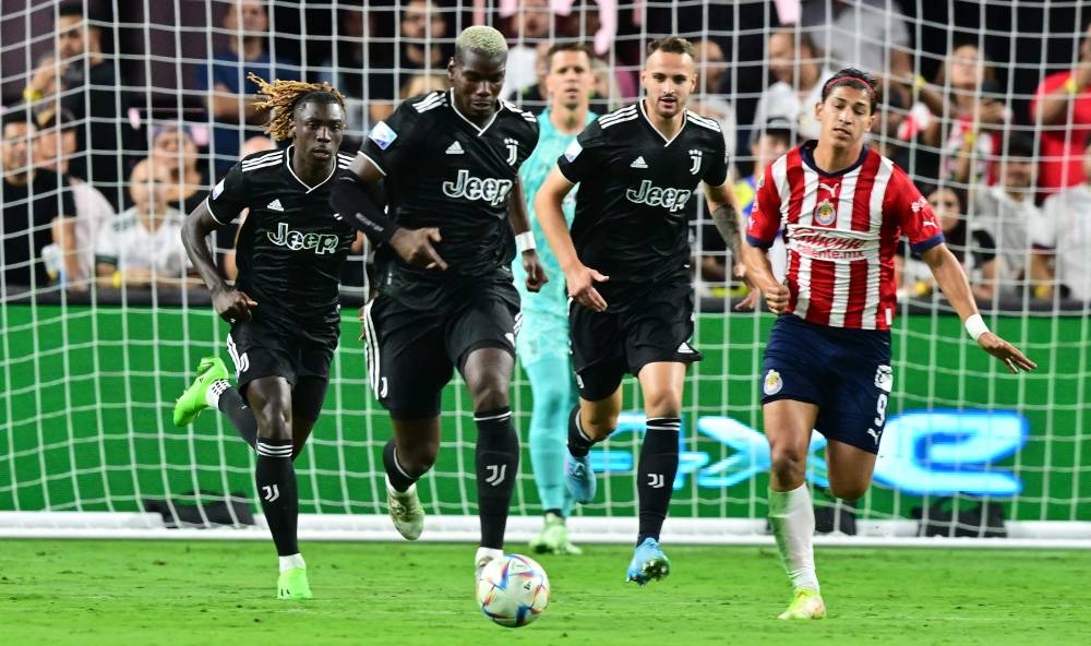 Juventus' midfielder Paul Pogba (second, left) runs with the ball under pressure from Chivas de Guadalajara's forward Angel Zaldivar in Las Vegas, Nevada July 22, 2022. ― AFP pic