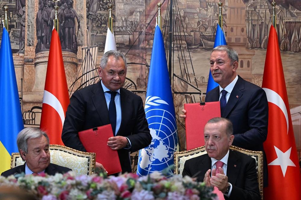(From left) United Nations (UN) Secretary-General Antonio Guterres, Russian Defence Minister Sergei Shoigu, Turkish Defence Minister Hulusi Akar and Turkish President Recep Tayyip Erdogan attend a signature ceremony of an initiative on the safe transportation of grain and foodstuffs from Ukrainian ports, in Istanbul, on July 22, 2022. ― AFP pic