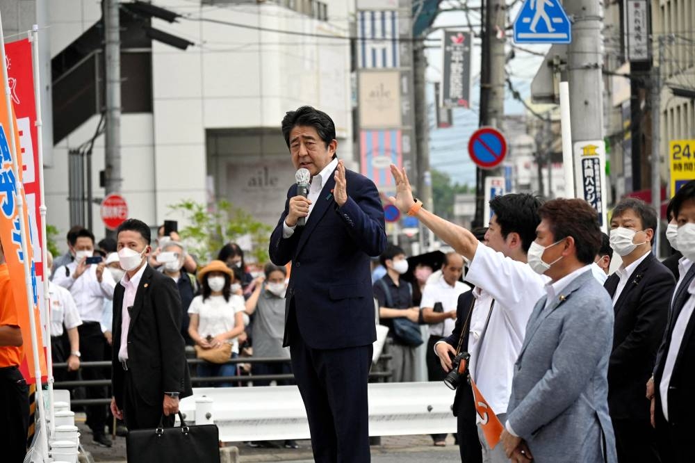 File photo of  former Japanese Prime Minister Shinzo Abe makes a speech before he was shot from behind by a man in Nara, western Japan July 8, 2022 in this photo taken by The Asahi Shimbun. ― Reuters pic