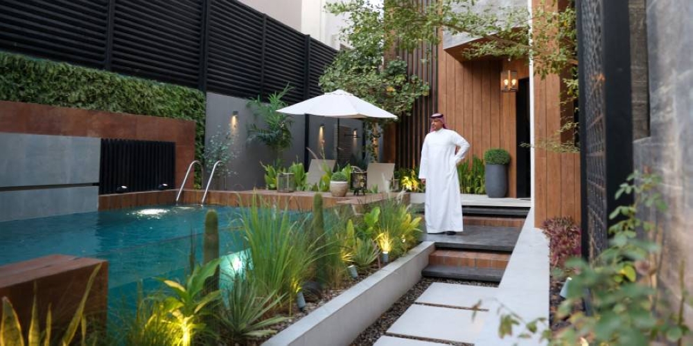 Haitham al-Madini stands next to the pool in his recently renovated villa in the Saudi capital, Riyadh. ― ETX Studio pic