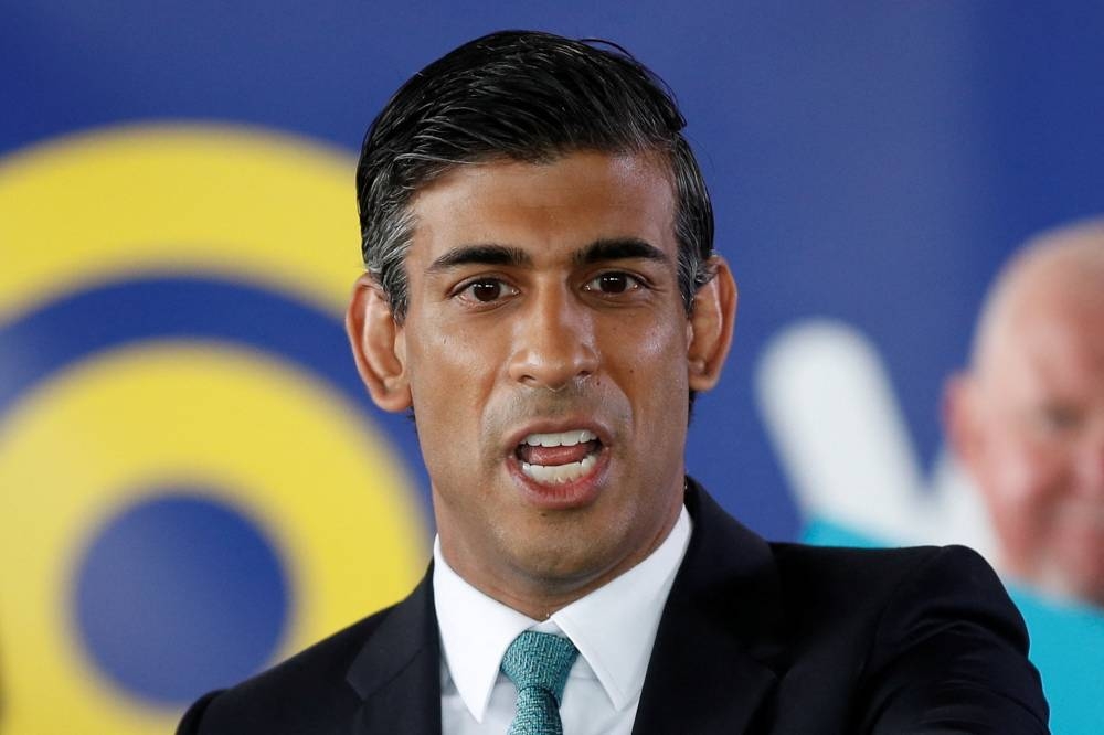 Sunak yesterday described himself as 'the underdog' after Truss topped opinion polls among the Conservative Party members. — Reuters pic