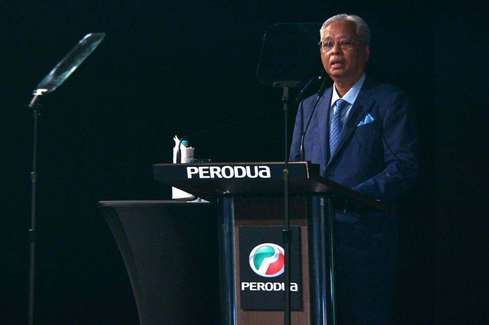 Prime Minister Datuk Seri Ismail Sabri Yaakob delivers his speech during the official launch of the Perodua new model Alza at Kuala Lumpur Convention Centre in Kuala Lumpur, 20 July 2022. - Picture by Shafwan Zaidon