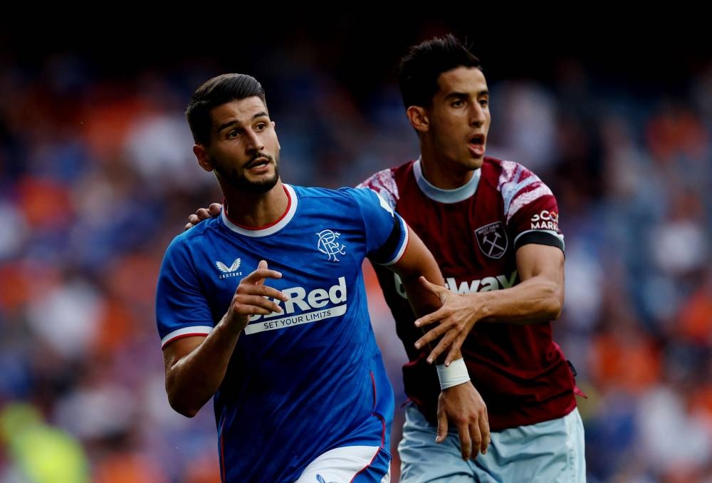 Rangers' Antonio Colak in action with West Ham United's Nayef Aguerd (right) during a friendly at the Ibrox Stadium, Glasgow July 19, 2022. — Reuters pic