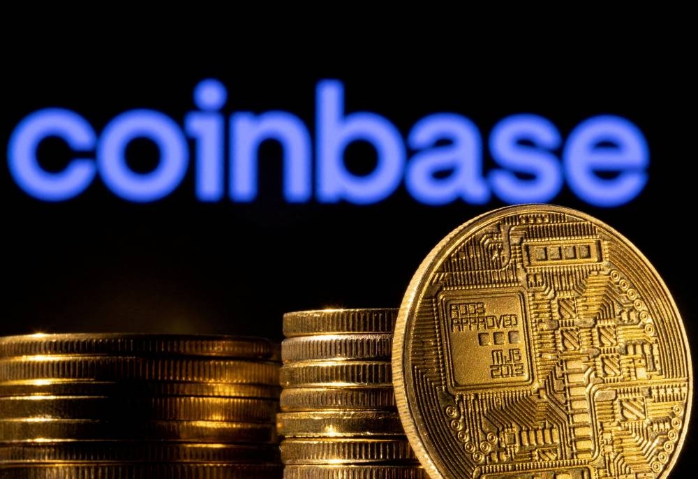 A representation of the cryptocurrency is seen in front of Coinbase logo in this illustration taken, March 4, 2022. ― Reuters file pic