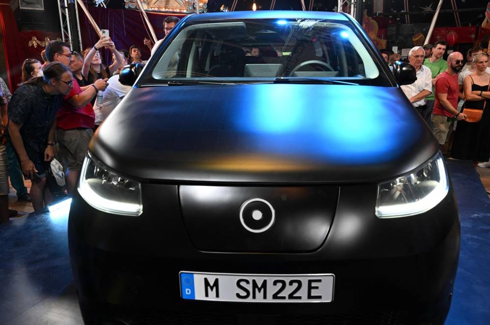 The ‘Sion’, a family car covered entirely with solar panels, should go into mass production in the second half of 2023. — AFP pic