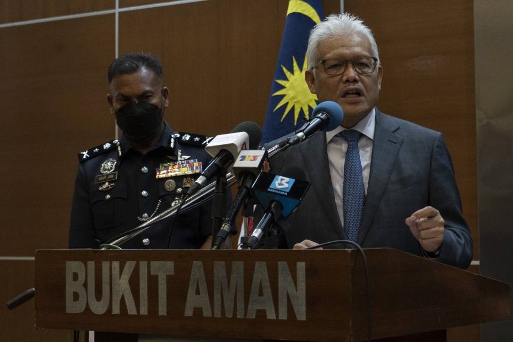 Home Minister Datuk Seri Hamzah Zainudin (right) had tabled the IPCC Bill that has been criticised as being toothless in providing oversight towards police's conduct. — Picture by Shafwan Zaidon