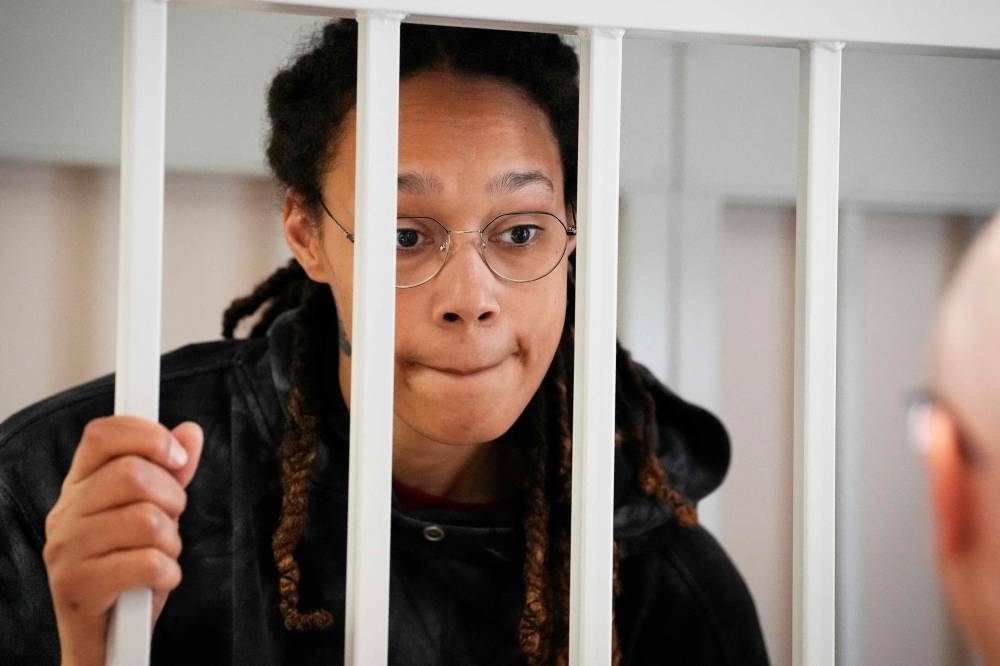 US WNBA basketball superstar Brittney Griner reacts inside a defendants’ cage before a hearing at the Khimki Court, outside Moscow, July 26, 2022. — AFP pic 