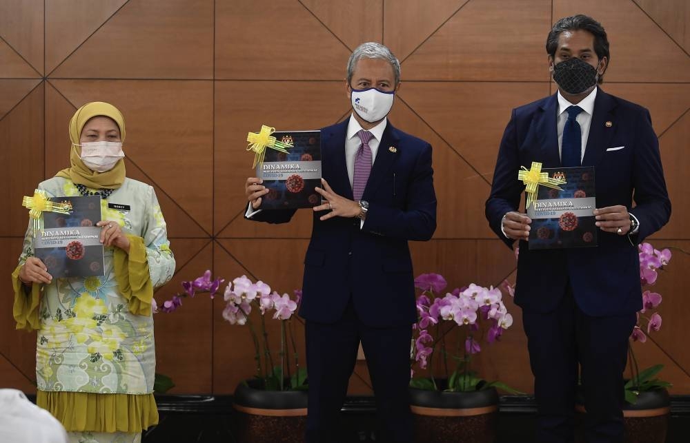 Dewan Rakyat Speaker Tan Sri Azhar Azizan Harun with Health Minister Khairy Jamaluddin and Tourism, Arts and Culture Minister Datuk Seri Nancy Shukri during the book launch at Parliament Building, July 26, 2022. — Bernama pic 