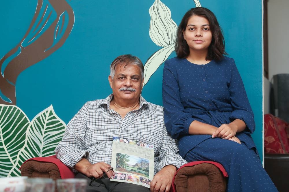 Niba and her Pakistani father Syed Riaz Zaidi talk about the struggles the family has to go through to get Malaysian citizenship. — Picture by Choo Choy May
