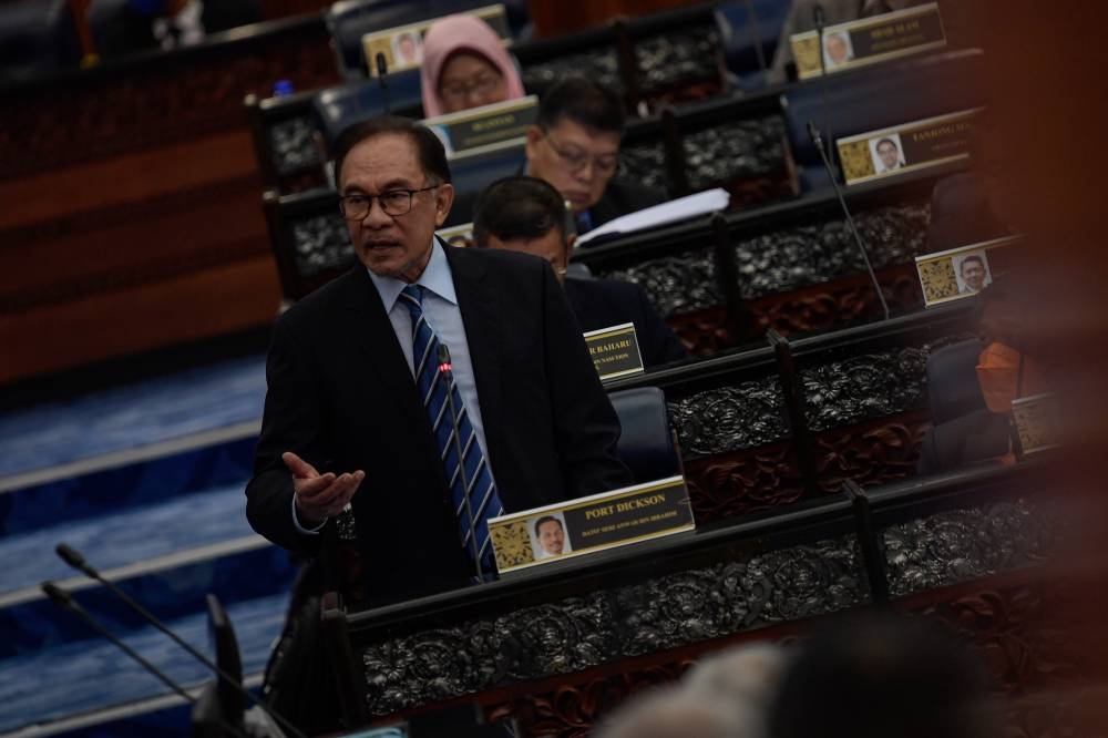 Opposition Leader Datuk Seri Anwar Ibrahim addresses members of Parliament in Kuala Lumpur July 27, 2022. — Bernama pic