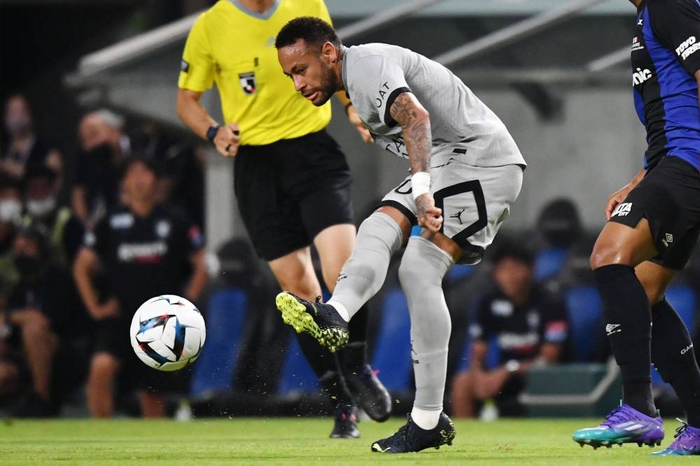 Paris Saint-Germain’s Brazilian forward Neymar passes the ball during PSG’s Japan Tour football match against Gamba Osaka at Suita stadium in Osaka, July 25, 2022. — AFP pic 