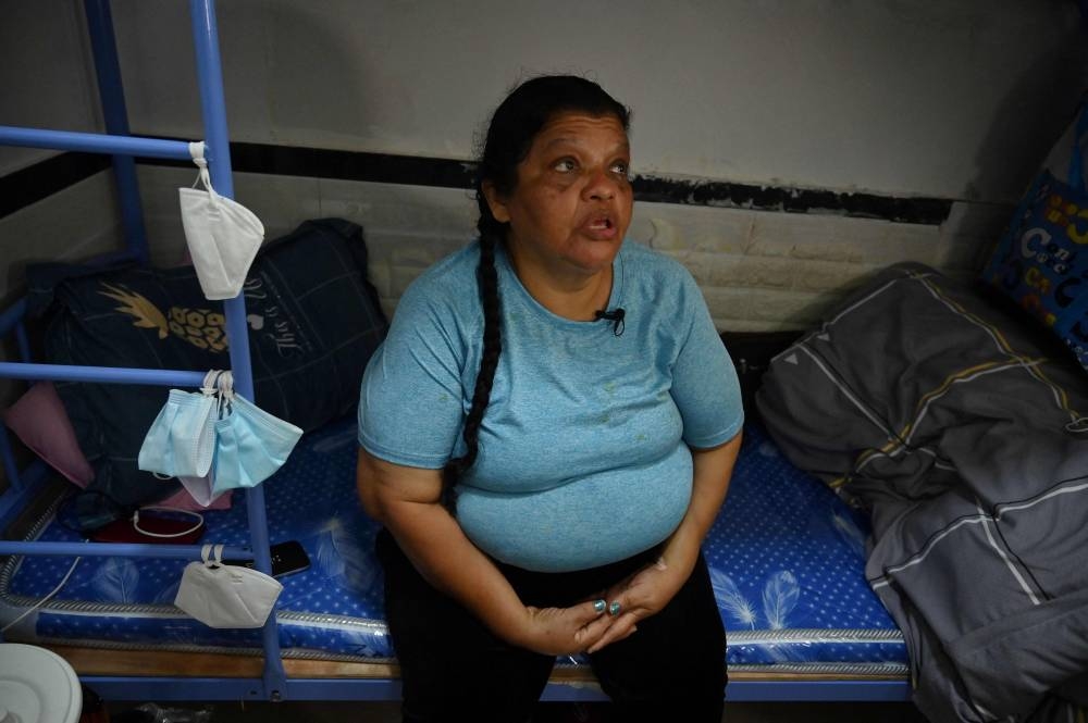 This photo taken on May 9, 2022 shows Peruvian national Zoila Lecarnaque Saavedra, recently released after serving time in prison for drug trafficking and now awaiting deportation, talking to AFP in a cramped hostel in Hong Kong. — AFP pic