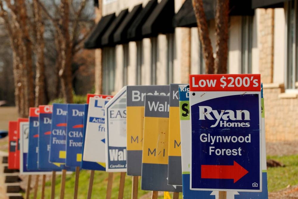 Real estate signs advertise new homes for sale in multiple new developments in York County, South Carolina February 29, 2020. ― Reuters file pic