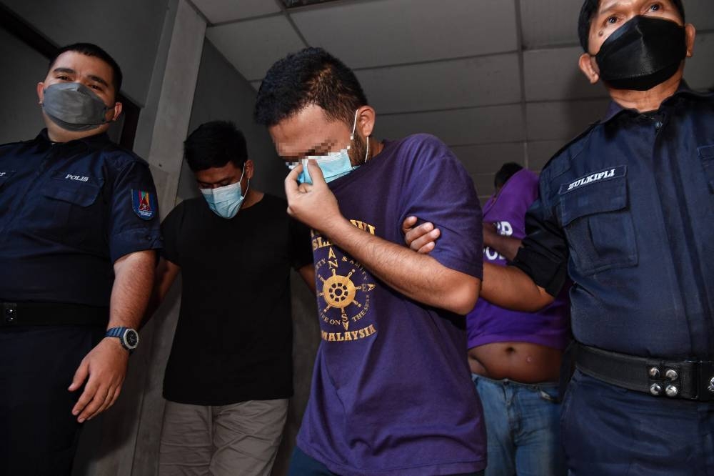 The independent speaker, in his 30s, arrived in handcuffs and was taken to the Magistrates’ Court at about 1pm in Ipoh, July 28, 2022. — Bernama pic 