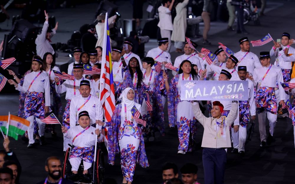 Athletes from Malaysia march during the Commonwealth Games opening ceremony in Birmingham July 28, 2022. — Bernama pic