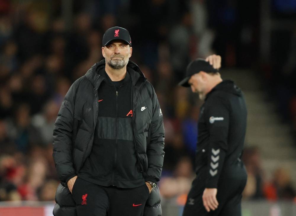 Jurgen Klopp’s side came within two matches of football immortality, only to fall just short as Manchester City pipped them to the Premier League title on the final day of the season. — Reuters pic