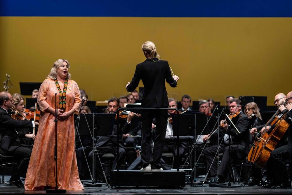 Soprano singer Liudmyla Monastyrska (left) and musicians from the Ukrainian Freedom Orchestra are led by conductor Kerii-Lynn Wilson take part in a rehersal in Warsaw Opera before their international tour, July 28, 2022. — AFP pic