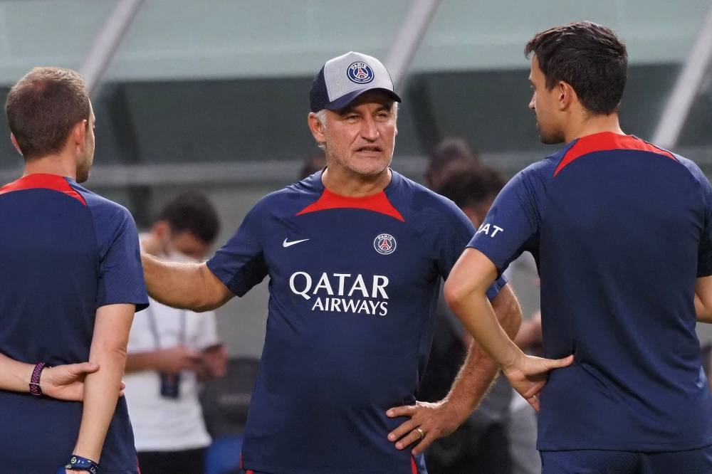 French football club team Paris Saint-Germain’s head coach Christophe Galtier (centre) speakes with coaches prior to their training session at Suita stadium in Osaka on July 24, 2022, on the eve of their team's friendly match against Gamba Osaka as part of their summer tour of Japan. — AFP pic