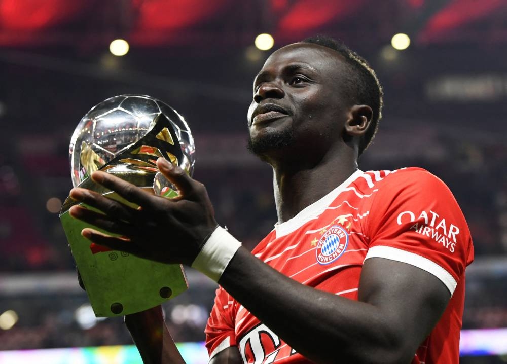 Bayern Munich's Sadio Mane celebrates with the trophy after winning the DFL Super Cup in Leipzig July 30, 2022. — Reuters/Annegret Hilse pic