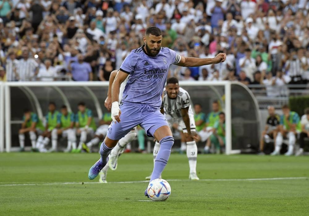 Karim Benzema of Real Madrid scores a goal on a penalty kick against Juventus during the first half of their friendly football match at the Rose Bowl on July 30, 2022 in Pasadena, California. — Kevork Djansezian/Getty Images/AFP pic