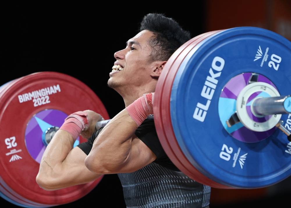 National weightlifter Muhamad Aznil Bidin in action in the 61kg category weightlifting event at the Birmingham 2022 Commonwealth Games, July 30, 2022. — Bernama pic