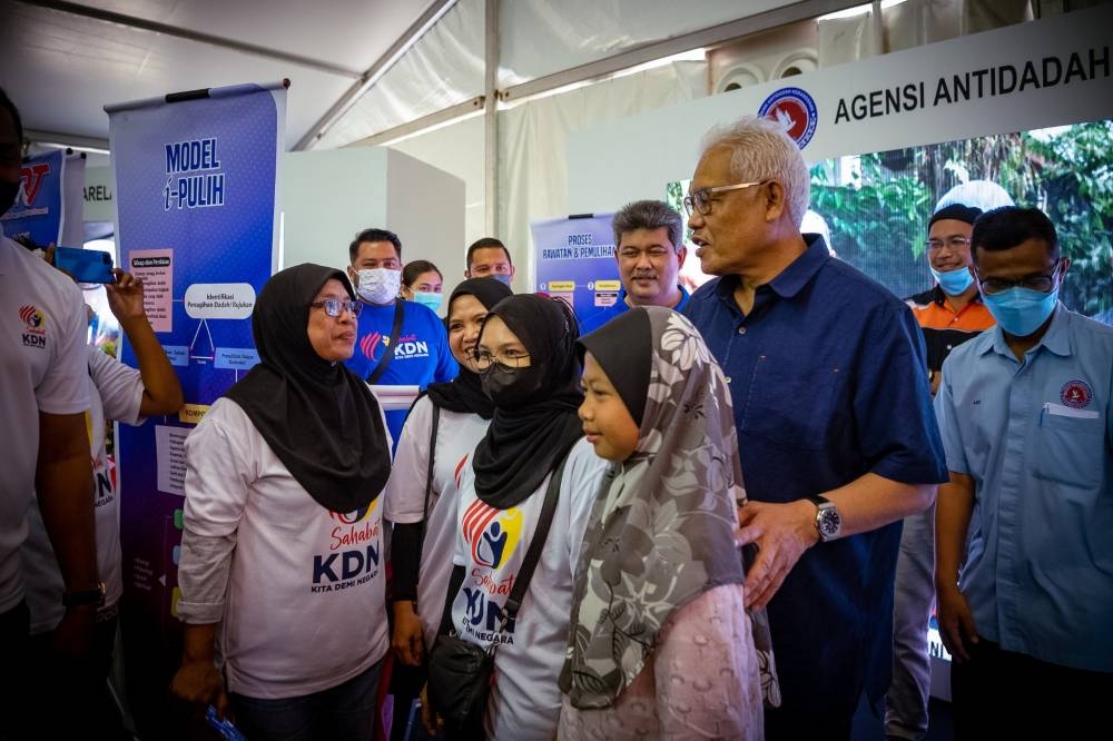 Datuk Seri Hamzah Zainuddin meets supporters of Sahabat KDN during the 'Kita Demi Negara' roadshow in Batu Kurau, Perak, July 24, 2022. — Picture courtesy of Home Ministry/Facebook