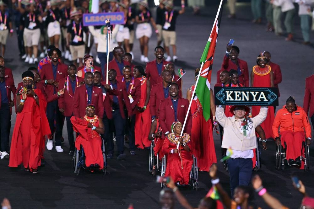 Kenya's flag bearers Ferdinand Omanyala and Carolina Wanjira and teammates take part in the opening ceremony for the Commonwealth Games at the Alexander Stadium in Birmingham July 28, 2022. — AFP pic