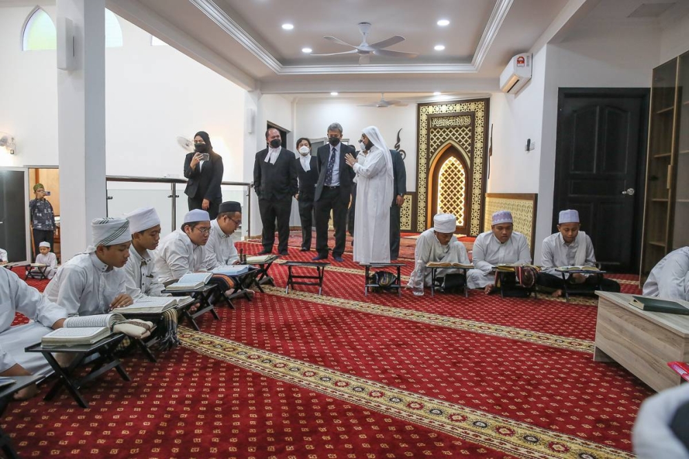 High Court judge Datuk Collin Lawrence Sequerah (centre) is seen here in the building labelled 