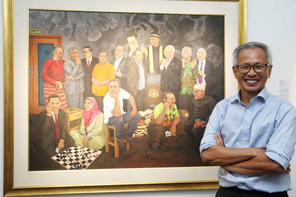 Tony Pua poses with his painting 'Langkah Sheraton' that will be sold as part of DAP’s GE15 fundraiser ‘Langkah Sheraton NFTs’ at Theatre Impian, Plaza Bukit Jalil August 1, 2022. — Picture by Choo Choy May