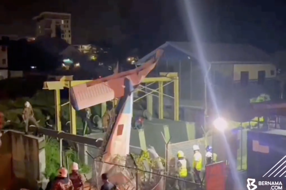 A screengrab from a Bernama video of the scene at the site of the crash in Medan Gopeng, Ipoh.