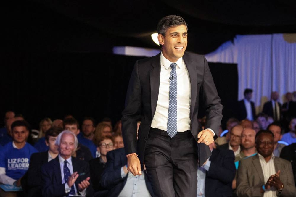 Contender to become the country's next Prime minister and leader of the Conservative party Britain's former Chancellor to the Exchequer Rishi Sunak arrives to take part in a Conservative Party Hustings event in Leeds July 28, 2022. — AFP pic