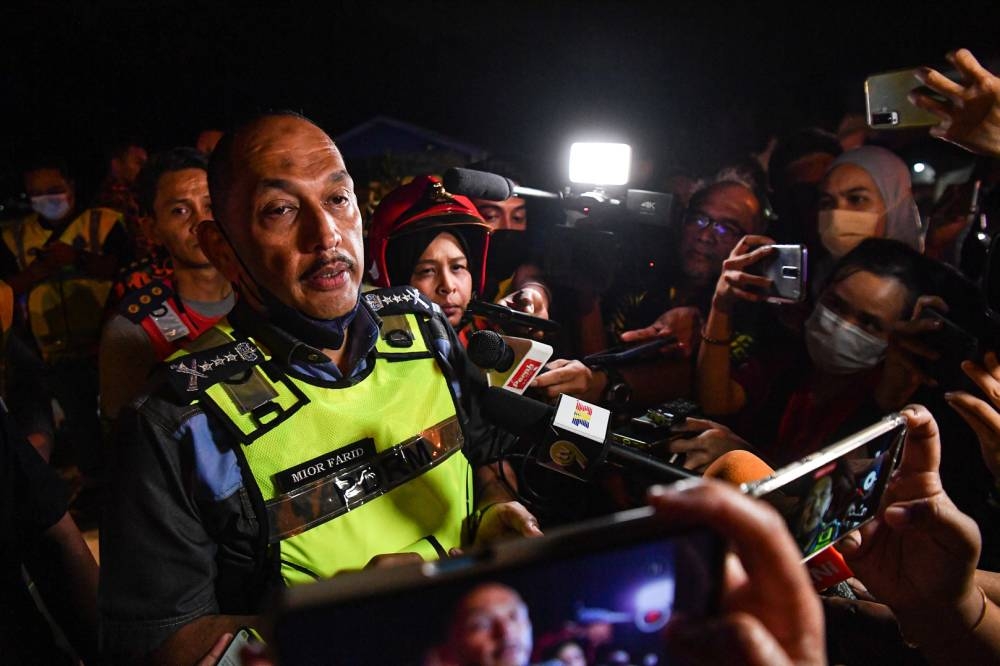 Perak police chief Datuk Mior Faridalathrash speaks to members of the press at the site of the plane crash in Medan Gopeng, Ipoh August 1, 2022. — Bernama pic