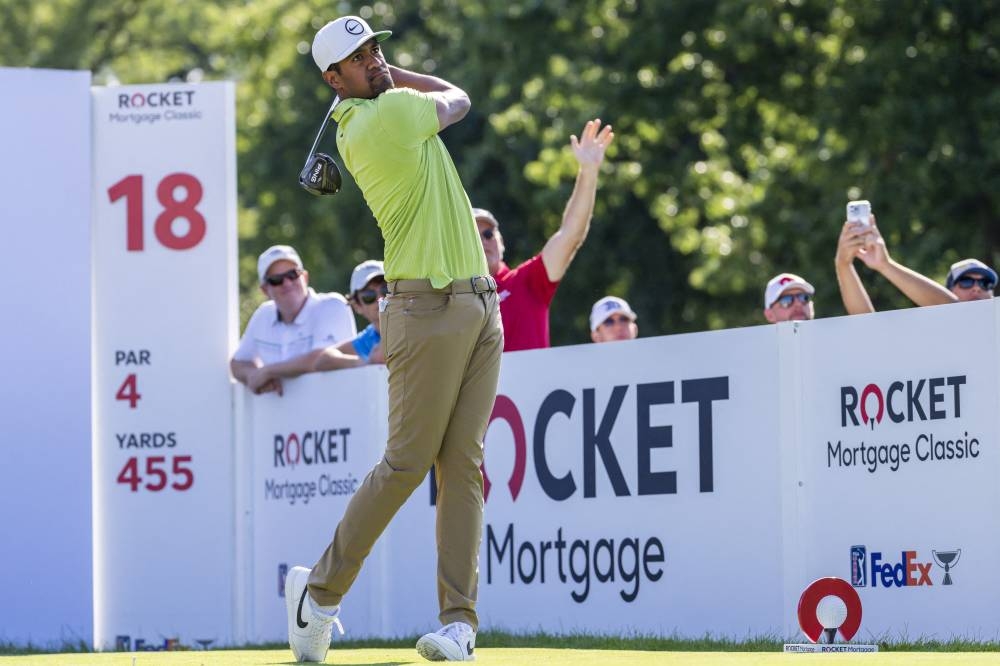 Tony Finau hits his tee shot on the par 4 eighteenth hole during the final round of the Rocket Mortgage Classic golf tournament. ― Raj Mehta-USA TODAY Sports via Reuters