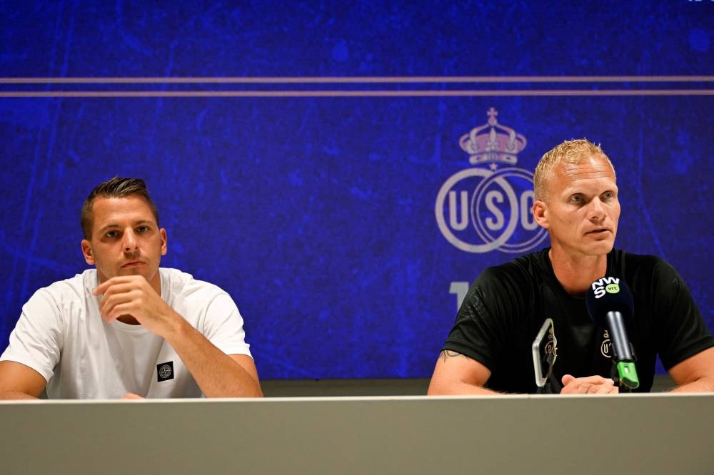 Royale Union Saint-Gilloise’s goalkeeper Anthony Moris (left) and head coach Karel Geraerts give a press conference on the eve of the Champions League third round qualification game against Rangers FC on August 1, 2022 in Heverlee. — AFP pic 