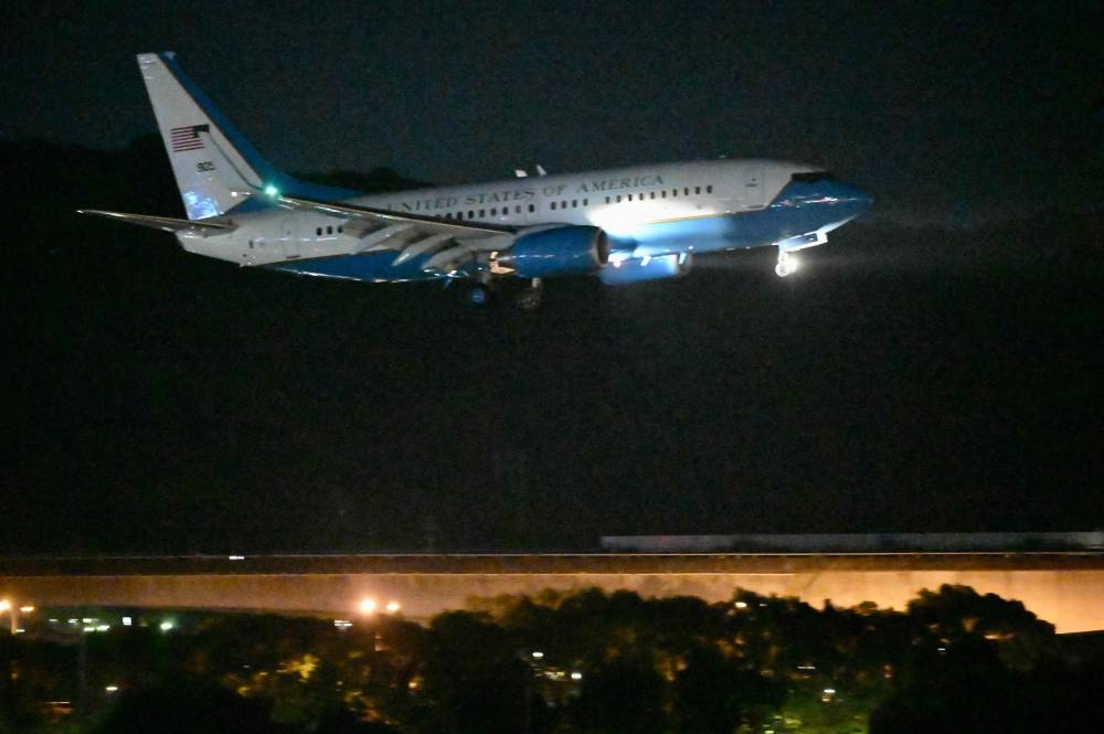 A US military aircraft with US House Speaker Nancy Pelosi on board prepares to land at Sungshan Airport in Taipei on August 2, 2022. - Pelosi landed in Taiwan on August 2 evening, defying days of increasingly stark warnings from China that have sent tensions between the world's two superpowers soaring. — AFP pic