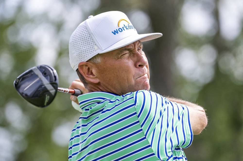 Davis Love III watches his tee shot on the fourteenth hole during the first round of the Rocket Mortgage Classic golf tournament in Detroit July 28, 2022. — Reuters pic  