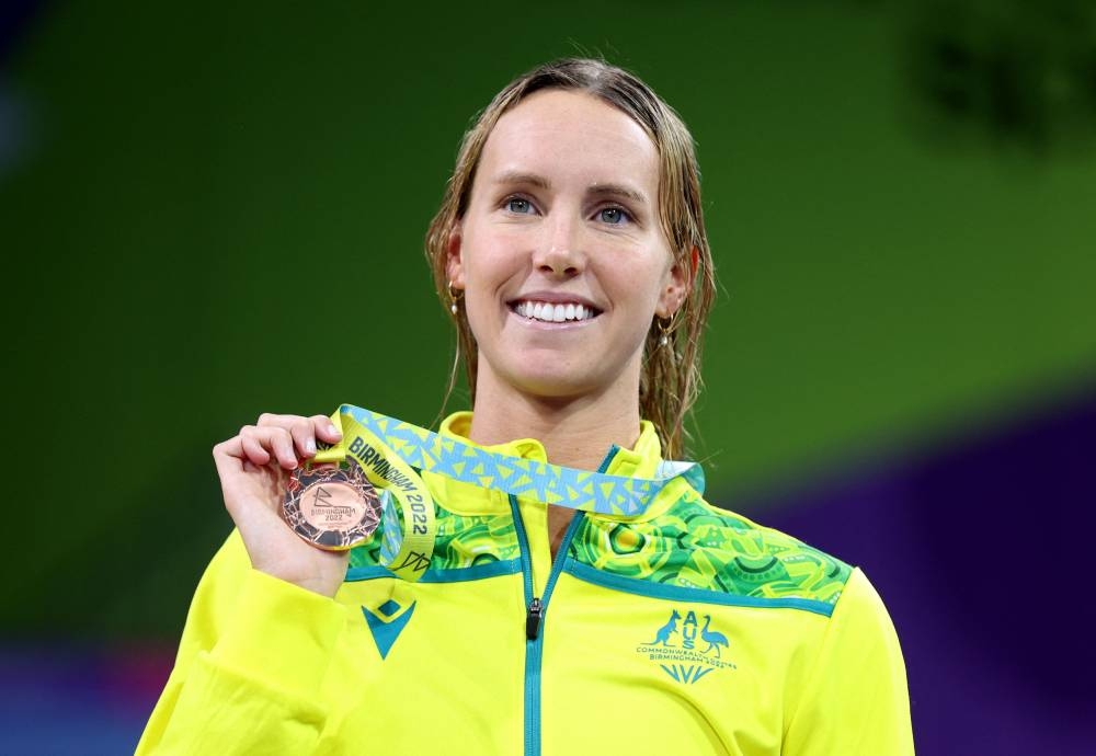 Bronze medallist Australia's Emma McKeon celebrates on the podium during the medal ceremony at the Sandwell Aquatics Centre, Birmingham August 2, 2022. — Reuters pic