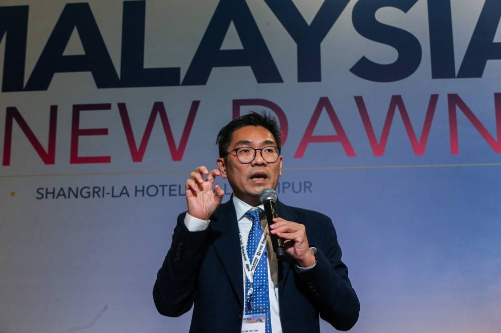 Sim Tze Tzin says Putrajaya must restore the public's onfidence in the political system by passing the political funding Bill before the 15th general election. — Picture by Ahmad Zamzahuri