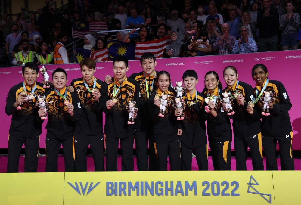 The Malaysia team pose with their gold medals during the medal presentation ceremony for the Mixed Team Gold Medal badminton match on day five of the Commonwealth Games at the NEC Arena in Birmingham, central England, August 2, 2022. — AFP pic 